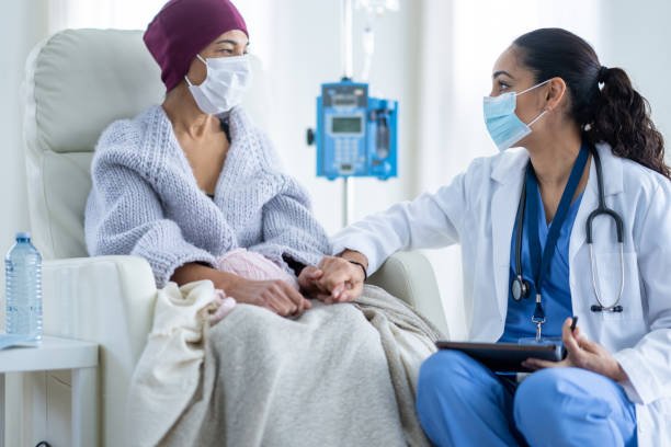 Oncologist Examining Patient